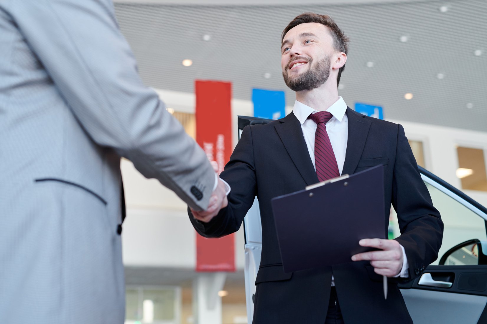 Salesman selling a new car